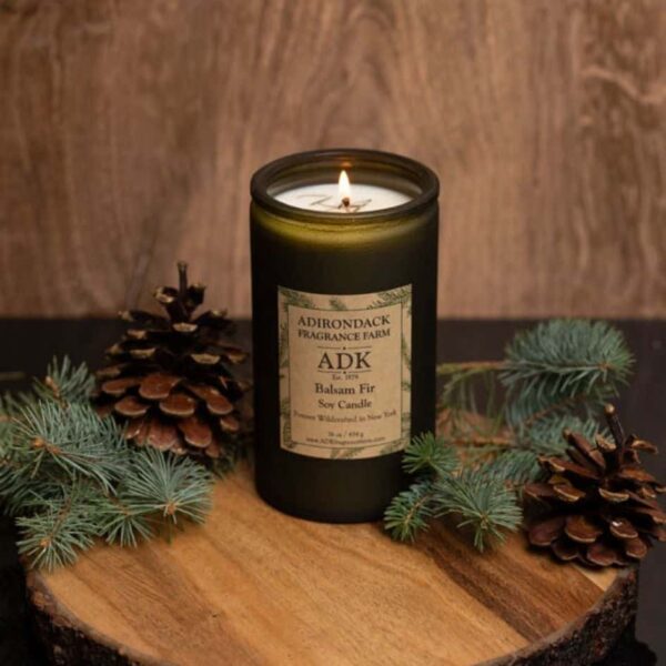 Balsam Fir Candle 16oz with ADK Label on a wooden plate