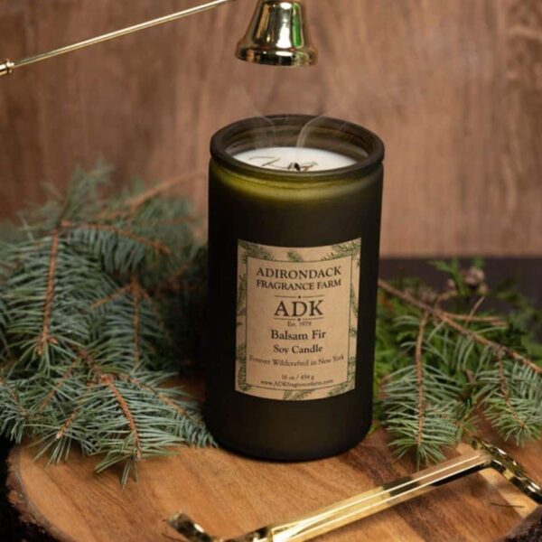 Balsam Fir Candle 16oz with ADK Label on a wooden plate with wick snuffer and wick trimmer