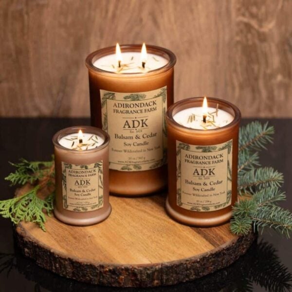 Balsam Cedar Candle Trio with ADK Labels on a wooden plate