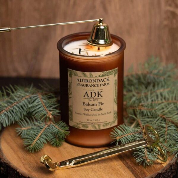 Balsam Fir Candle with an ADK Label on a wooden plate. 20oz with trimmer and snuffer