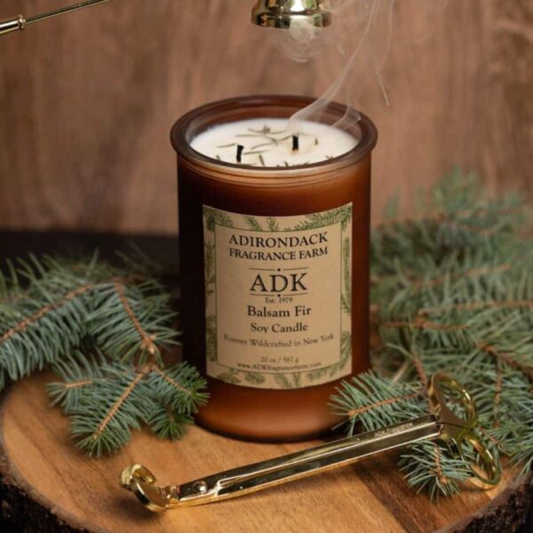 Balsam Fir Candle with an ADK Label on a wooden plate. 20oz with trimmer and snuffer