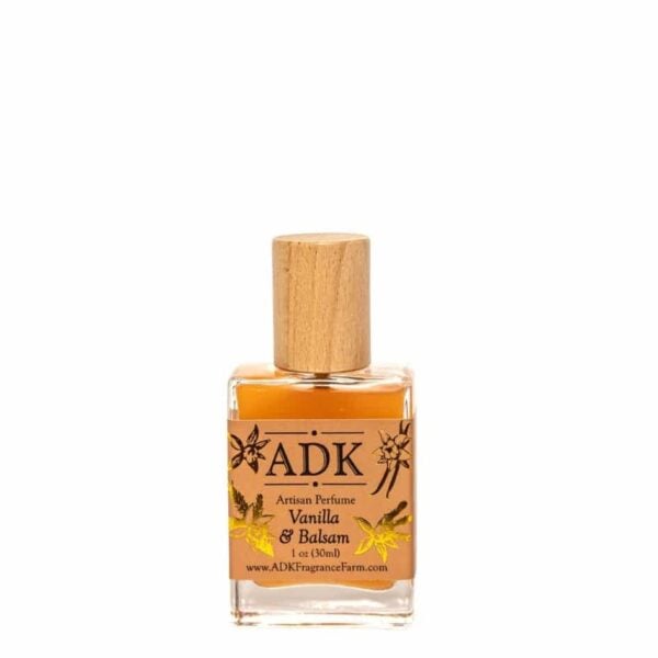 Vanilla Balsam perfume bottle. Designed with ADK logo and gold floral design.